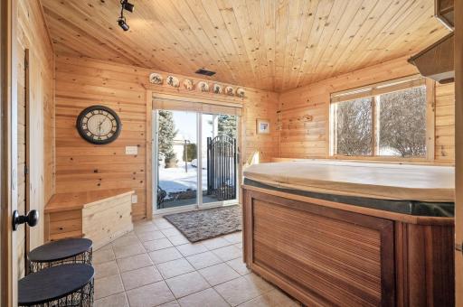 Hot tub room with sliding doors right into the backyard oasis