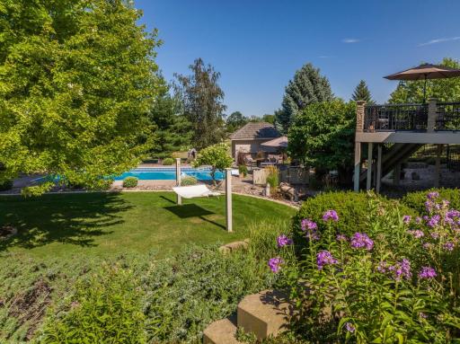 Property features beautiful landscaping that is at it's peak in the summertime months
