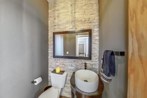 Main floor 1/2 bath with gorgeous stone tile!