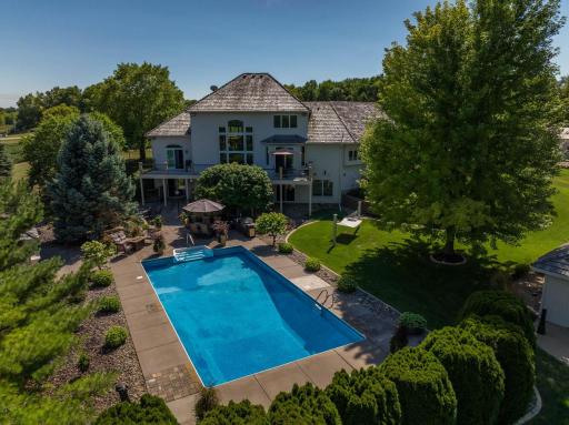 In-ground heated pool and beautiful landscaping for even more privacy