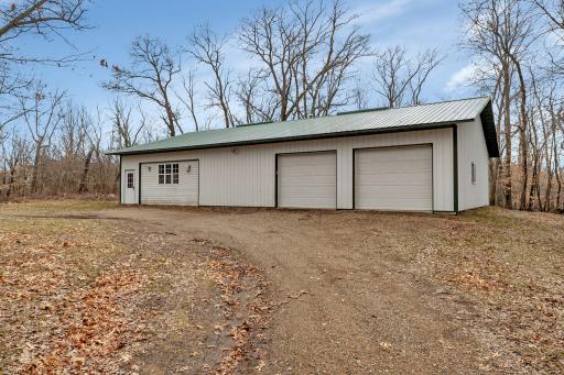 Welcome to the woods! This property features a 40x60 shouse with 1200 square feet of living space and an attached heated shop settled into 47 private acres of paradise.