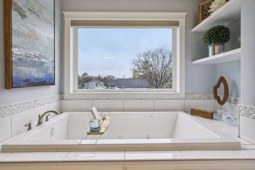 Large, jetted soaking tub in addition to walk in shower