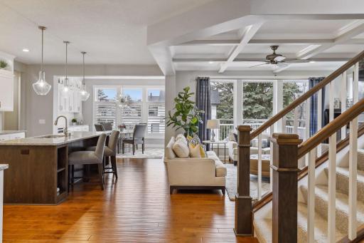 Light filled and airy, the open floor plan creates a lovely flow between kitchen, dining and living areas
