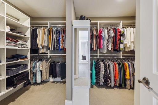Huge walk in closet with organizing system in place