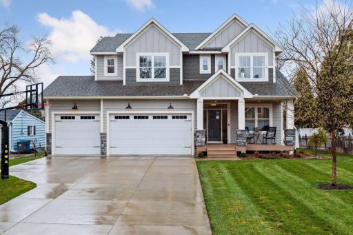 Welcome home! Beautiful curb appeal, 4 car garage (2 tandem) and a welcoming front porch.
