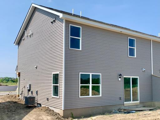 Pardon the mess, we're still under construction! The back of the home will have a patio overlooking a stunning view! Photo of subject property.