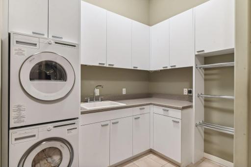 Also features a convenient mudroom with laundry facilities, all conveniently situated off the garage, ensuring seamless functionality and effortless organization.