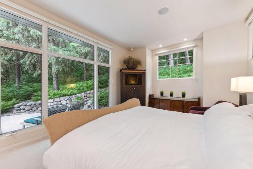 Continuing through the hallway, you arrive at the primary bedroom suite, an oasis of privacy and relaxation on the main level.