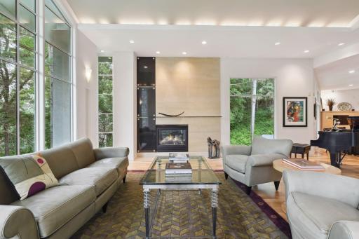 A modern fireplace serves as a sleek centerpiece, offering a perfect nook for cozying up on chilly evenings.