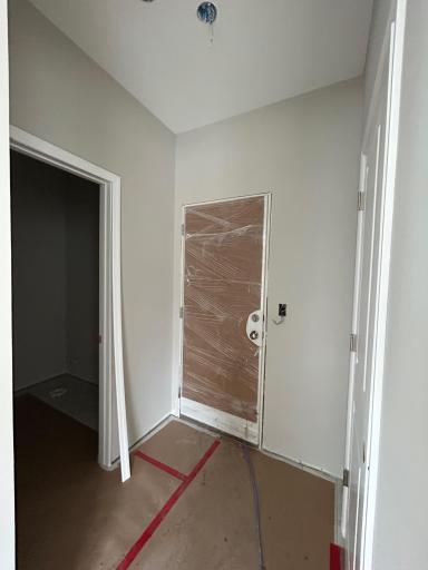 Mudroom w/ Coat Closet and !/2 Bathroom. Photo Taken of Actual Home.