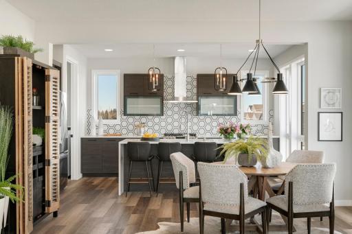Urban inspired interiors with gourmet kitchens and luxury features. Photo is of model home; options and features will vary.