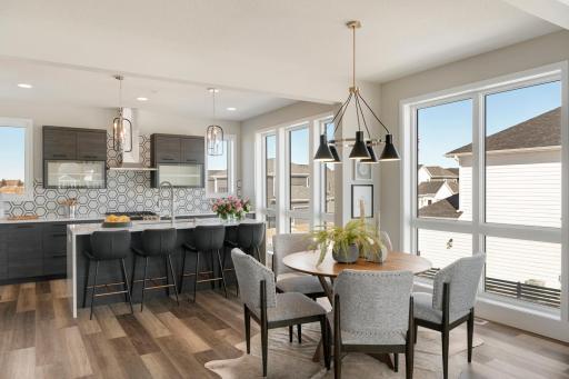 Urban inspired interiors with gourmet kitchens and luxury features. Photo is of model home; options and features will vary.
