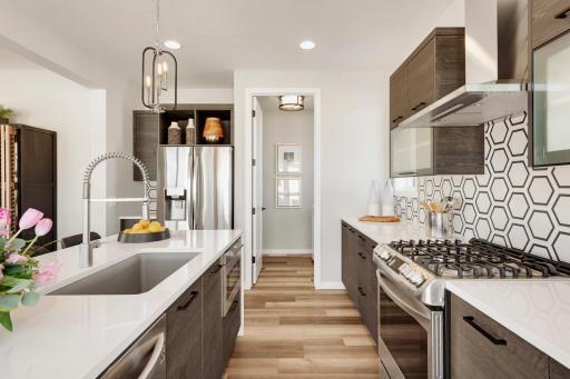 Urban inspired interiors with gourmet kitchens and luxury features. Photo is of model home; options and features will vary.