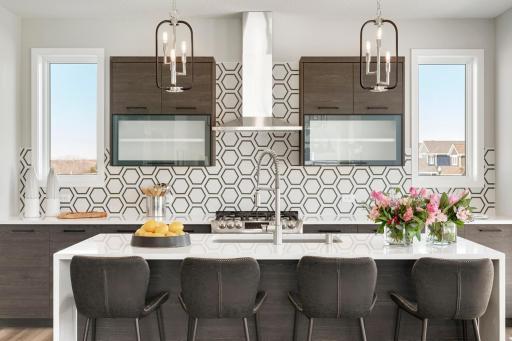 Urban inspired interiors with gourmet kitchens and luxury features. Photo is of model home; options and features will vary.