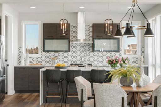 Urban inspired interiors with gourmet kitchens and luxury features. Photo is of model home; options and features will vary.
