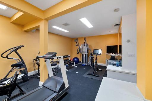 Fantastic work out room with finished storage area