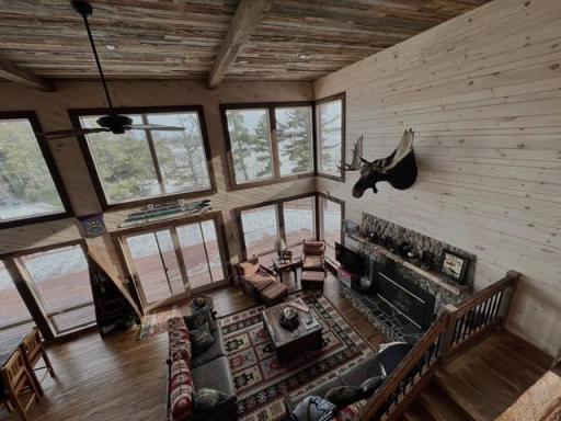2-Story Living Room with a wood fireplace.