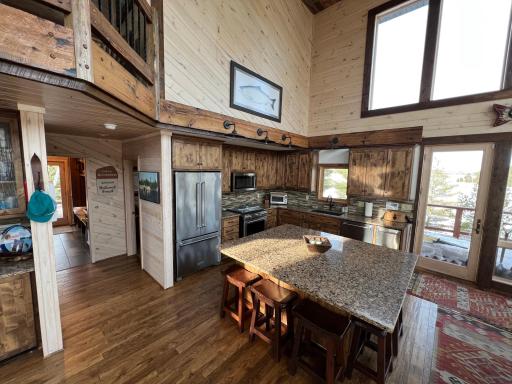 The Kitchen has been completely redone with granite countertops, hardwood floors, new appliances, lighting and cabinets.