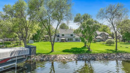 Attractive flat 3/4 + acre lot with 125+ feet of shoreline