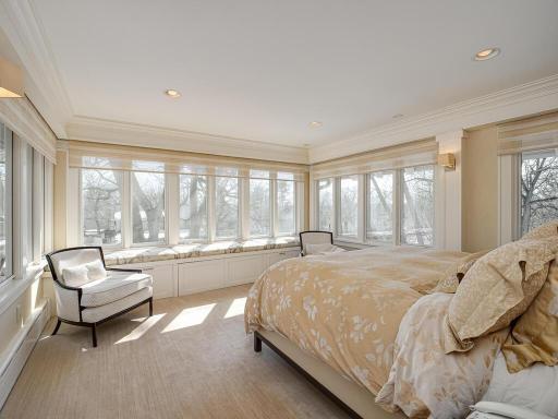 The spectacular fully remodeled Primary Suite has it all! Large Bedroom with 3 walls of upgraded windows with electronic shades, window seats, recessed lighting and crown moldings