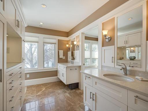 The carefully thought out remodel created 2 large walk-in closets with built-in organizers and dressers and a fantastic full Bath with double vanities, separate large walk-in shower and soaking tub, porcelain tile floor.