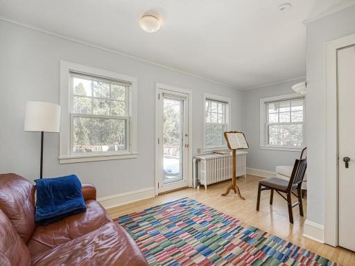 Bedroom 4 is being used as a music room and has a door to the large rooftop deck over the garage.