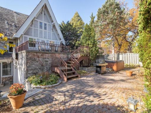 Large brick patio perfect for entertaining. Private hot tub can stay with home.