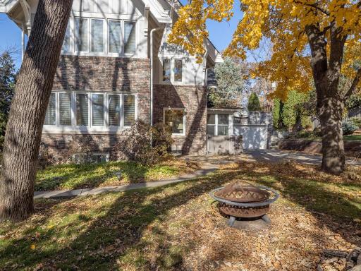 Large side yard with fire pit and room for family fun.