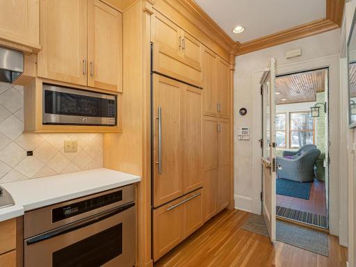 Kitchen opens to 3 season heated porch/mudroom