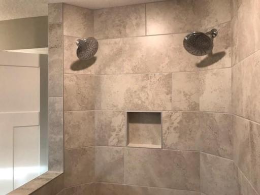 Walk-in shower with dual shower heads! Finishes will vary