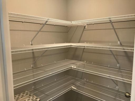 Kitchen pantry has plenty of storage space. Previous home, finishes will vary.