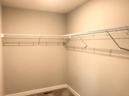 Large owners closet with room for two. Previous home, finishes will vary.
