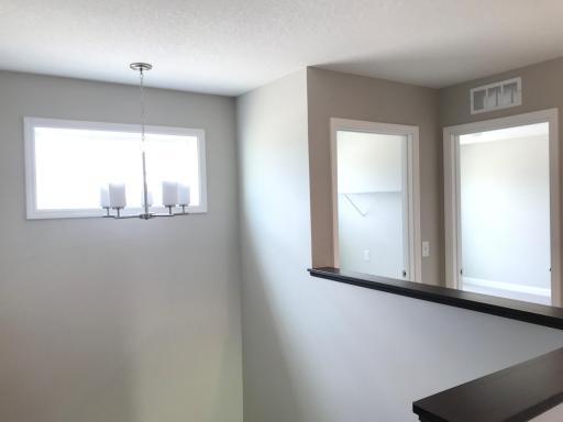 Upper level has quite a bit of space with two linen closets and leads to the laundry room as well.jpg