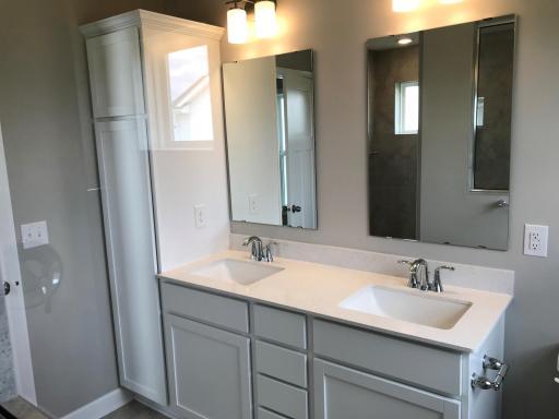 Primary bath includes a linen closet, and dual vanity!.jpg