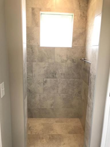 Primary bath with incredible walk-in shower. Tile seat, walls and floors, so nice.jpg