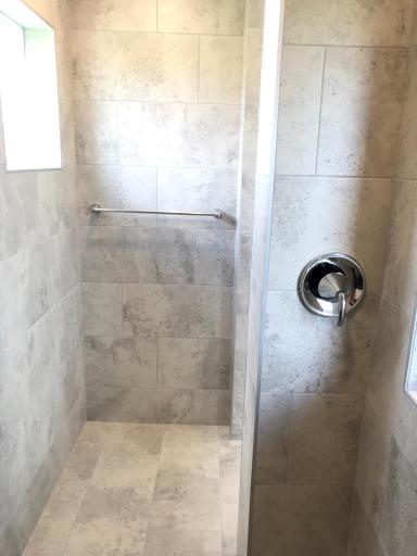 Primary bath with incredible walk-in shower. Tile seat, walls and floors, so nice!!.jpg