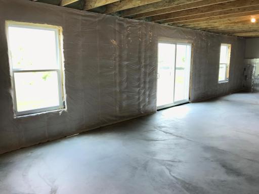 The unfinished LL has a roughed-in bath and walks out to the back yard.jpg