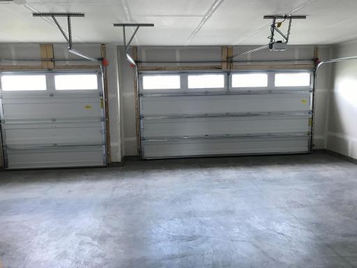 Handy three car garage with door opener.jpg