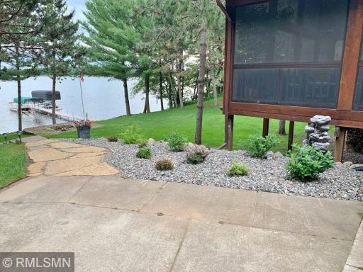 Beautiful landscaping off your screened in porch.