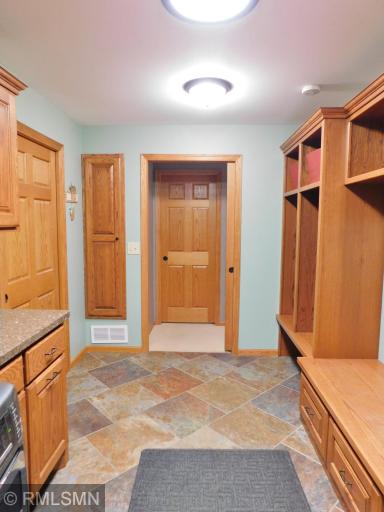 Main floor entry off the garage, storage and laundry room.