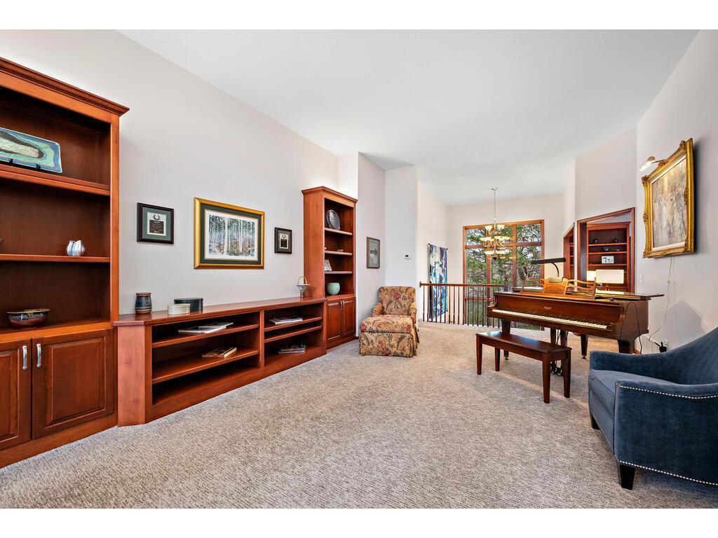 Plenty of built in cabinets and shelving for all of your needs...even a perfect place for a piano!!