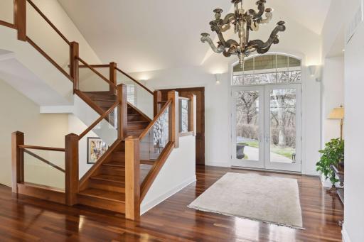 Entry with gleaming cherry flooring