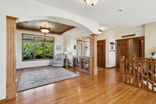 The formal dining room (currently utilized as a sitting room) has crown molding and neutral paint. And those 8" wide oak posts? Wow.