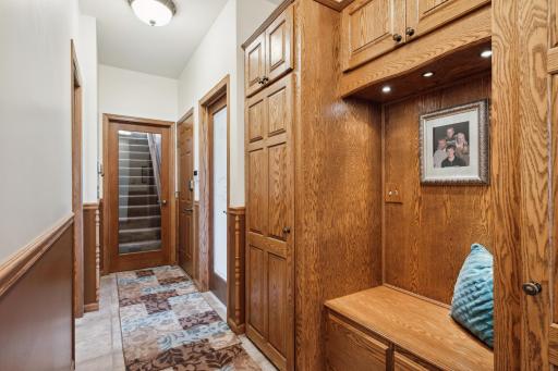 The Mud Room has easy to clean up ceramic tile flooring, a built in solid oak bench with cabinetry and lighting. It also has direct access to the garage, kitchen, laundry room, front entryway and half bath!