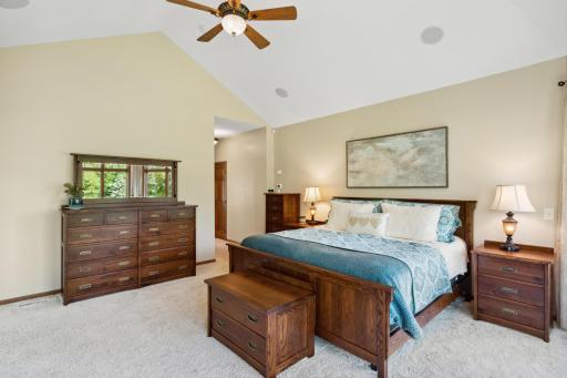 Vaulted 13' ceilings, ceiling fan and ceiling speakers are just some of the features in the primary bedroom.