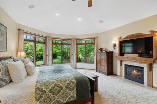 The deluxe primary bedroom has a 6 sash casement window with transom and honeycomb blinds.