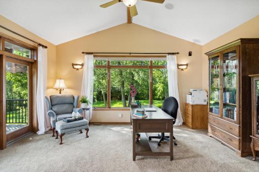 The four season porch is a perfect home office space, and has 11.5' vaulted ceilings with a natural wood beam and ceiling fan. And of course, amazing views.