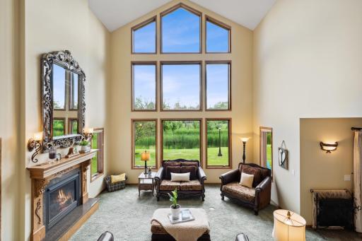 This is the place to hang out, with 23' ceilings, oak and granite surround Heat N Glo fireplace and HUGE windows.