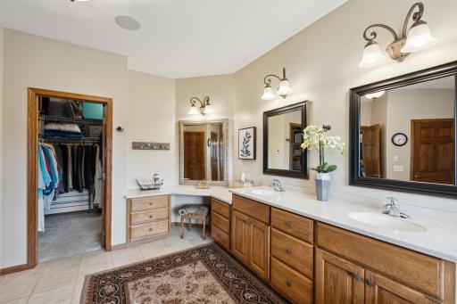 You darn well better have enough space to get ready in the morning in this enormous bathroom! The Corian counter top/sink combo makes cleaning easy peasy.