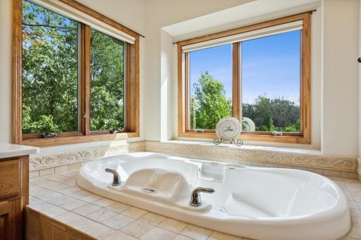 Take a soak in the tile surround Aquatic Jetted tub! So beautiful and relaxing.